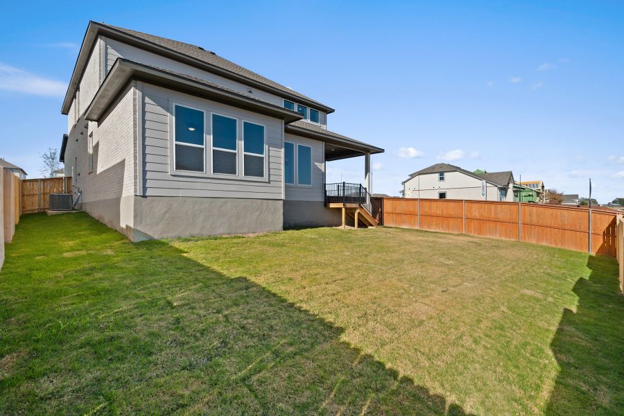 Exterior details and patio area of a home in Lariat, Liberty Hill (Image 25).