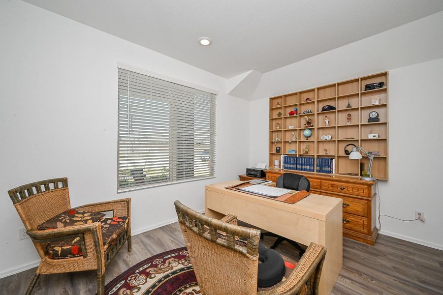 This well-appointed home office blends functionality with warmth, offering a refined workspace that supports productivity and comfort. This well-appointed home office blends functionality with warmth, offering a refined workspace that supports productivity and comfort.