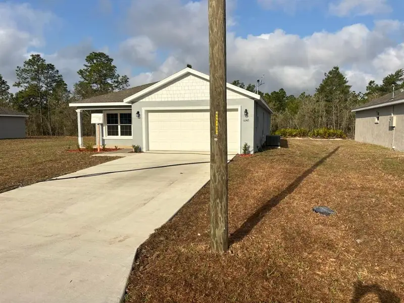 Front exterior of a new home in , Dunnellon, FL, highlighting curb appeal (Image 16). Front exterior of a new home in , Dunnellon, FL, highlighting curb appeal (Image 16).