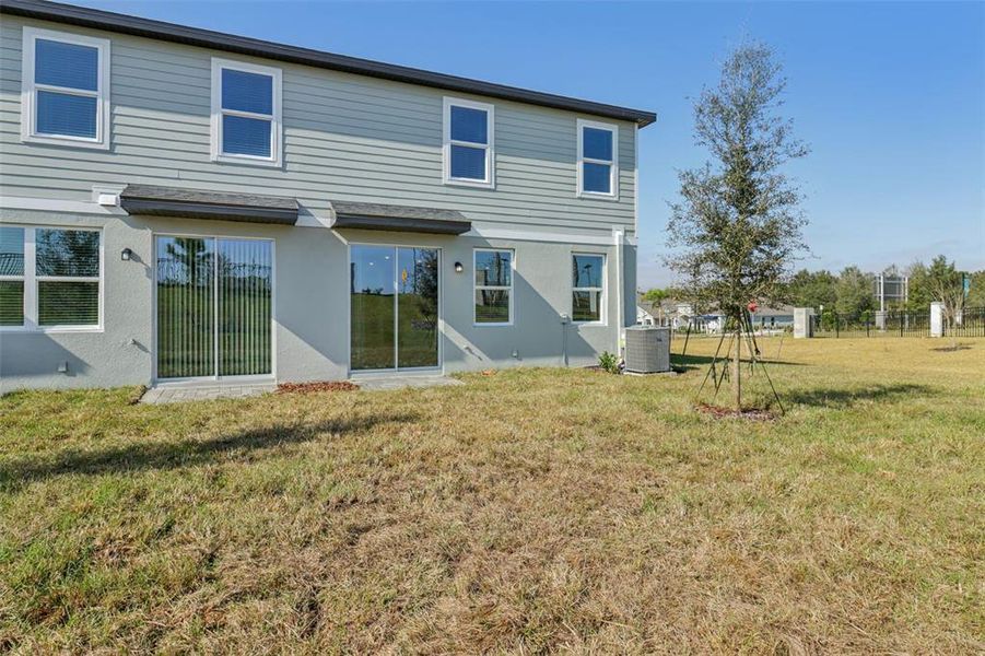 Exterior details and patio area of a home in The Reserve at Hammock Oaks Townes, Lady Lake (Image 21). Exterior details and patio area of a home in The Reserve at Hammock Oaks Townes, Lady Lake (Image 21).