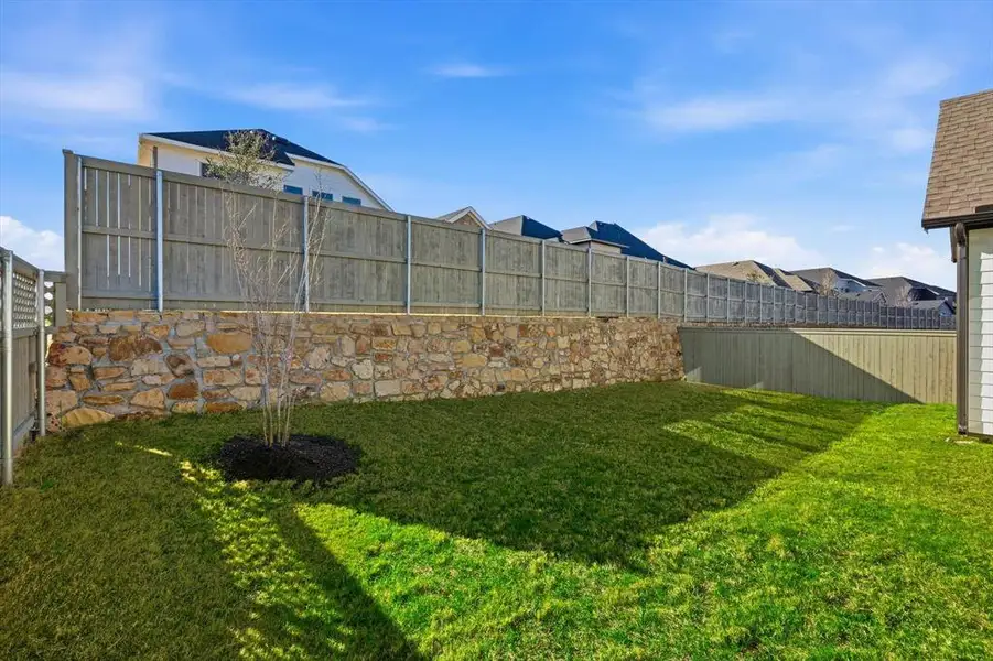 Exterior details and patio area of a home in Pecan Square - Gardens, Northlake (Image 3). Exterior details and patio area of a home in Pecan Square - Gardens, Northlake (Image 3).