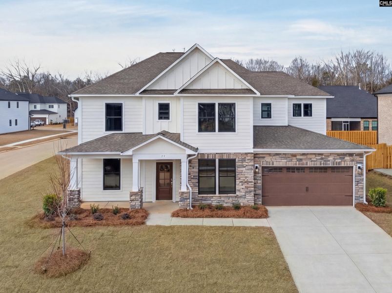 Front exterior of a new home in Collins Cove, Chapin, SC, highlighting curb appeal (Image 2).
