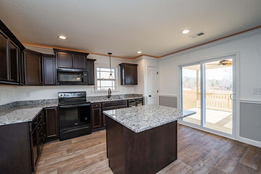 Representative furnished interior of a home built from the Sumter by Enchanted Homes in Ballentine Ridge, Lyman (Image 38).