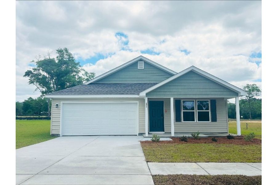 Front exterior of a new home in The Enclave at Cat Island Estates, Defuniak Springs, FL, highlighting curb appeal (Image 1). Front exterior of a new home in The Enclave at Cat Island Estates, Defuniak Springs, FL, highlighting curb appeal (Image 1).