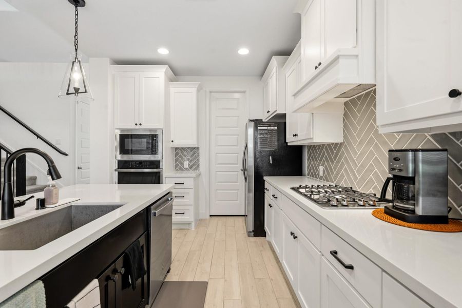 Additional view of the well-designed kitchen showcasing generous workspace and storage.