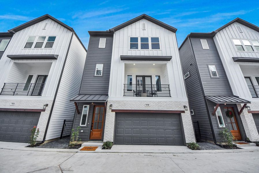 This modern three-story townhouse welcomes you with a sleek white-and-gray exterior, a balcony for enjoying the outdoors, and a spacious two-car garage. Designed for contemporary living, it combines style, functionality, and low-maintenance convenience in the heart of Oak Forest.