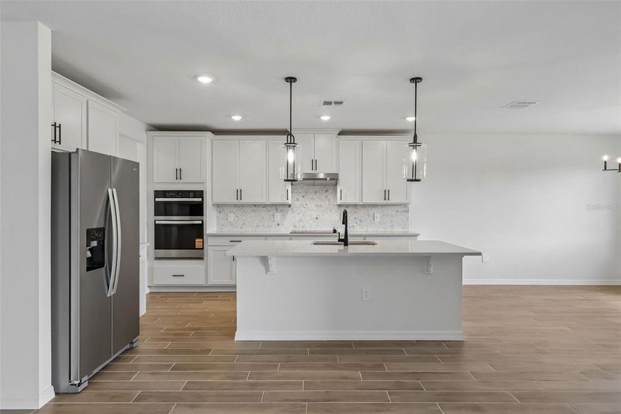 Furnished interior view inside a new home in The Grove at Stuart Crossing - Signature Series, Bartow (Image 7).