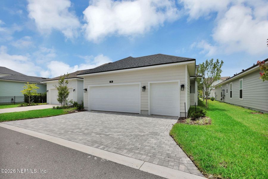 Front exterior of a new home in Seabrook Village at Seabrook, Nocatee, FL, highlighting curb appeal (Image 23).