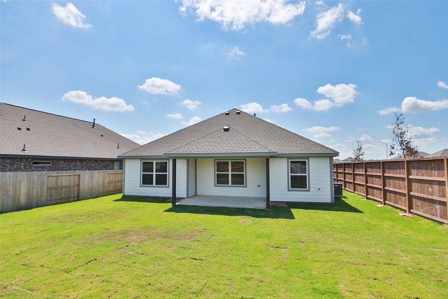 Front exterior of a new home in Oakwood Estates, Waller, TX, highlighting curb appeal (Image 2).