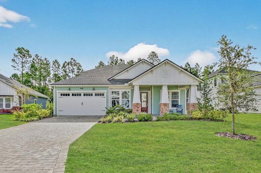 Front exterior of a new home in , St. Augustine, FL, highlighting curb appeal (Image 1).