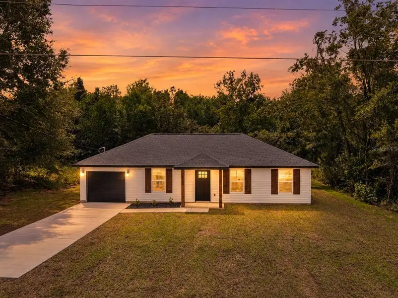 Front exterior of a new home in , Ocala, FL, highlighting curb appeal (Image 2). Front exterior of a new home in , Ocala, FL, highlighting curb appeal (Image 2).
