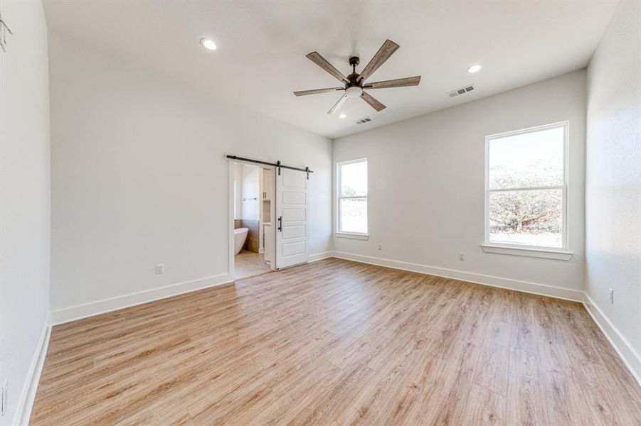 Master bedroom with optional barn door to the master bath.