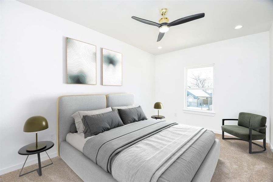 This inviting secondary bedroom features a neutral palette, plush carpeting, and ample closet space. With recessed lighting and a modern ceiling fan, it offers a comfortable and stylish retreat.