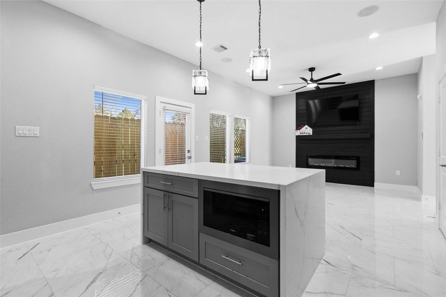 Standing at the island, you appreciate how the open view connects your kitchen to the living space, so you never miss a moment of the conversation. Standing at the island, you appreciate how the open view connects your kitchen to the living space, so you never miss a moment of the conversation.