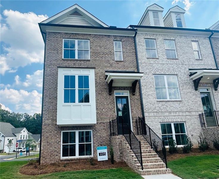 Front exterior of a new home in Evanshire Townhomes, Duluth, GA, highlighting curb appeal (Image 26).