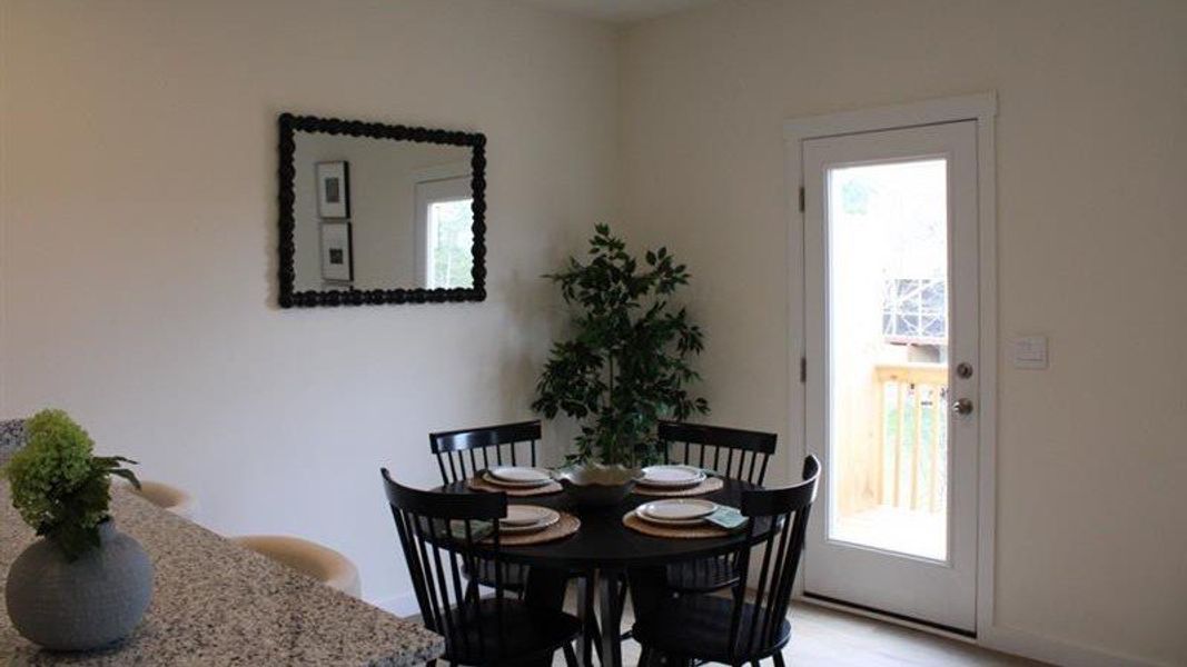 Representative furnished interior of a home built from the Altamont Townhome by D.R. Horton in Belcourt Landing, Cleveland (Image 6).