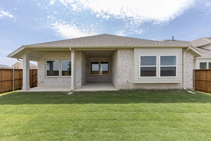 Front exterior of a new home in Creekview Meadows, Pilot Point, TX, highlighting curb appeal (Image 1).