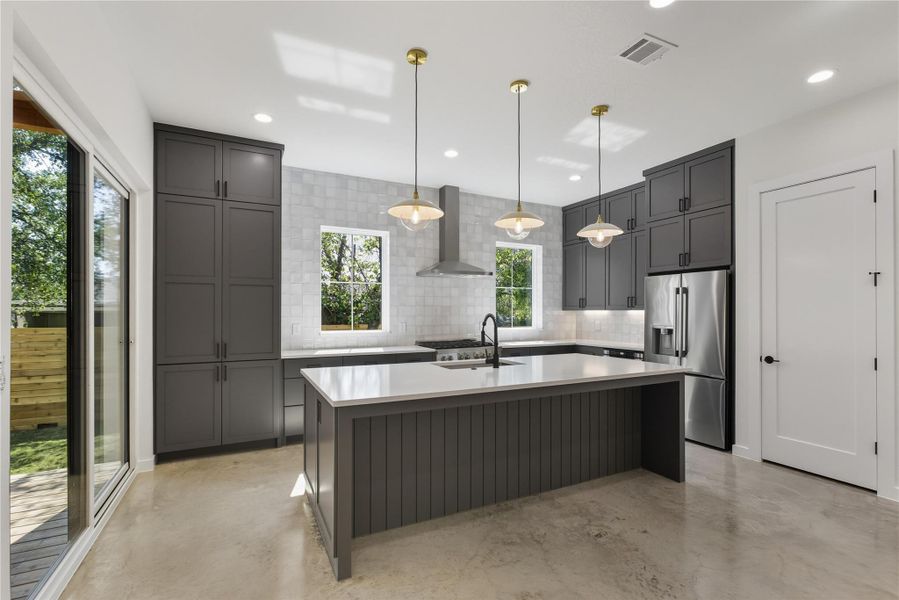Kitchen featuring kitchen island with Deep stainless sink, stainless steel appliances Kitchen featuring kitchen island with Deep stainless sink, stainless steel appliances