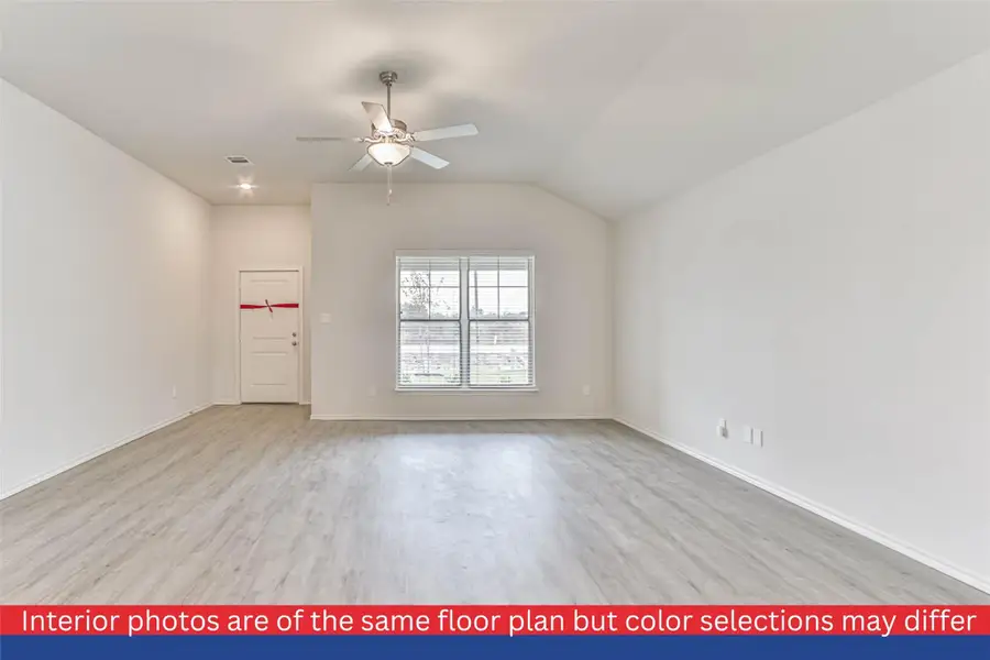 The heart of the home, this spacious living room offers a warm and inviting ambiance. Bathed in natural light, it provides a versatile space for entertaining guests or enjoying quiet evenings with loved ones.