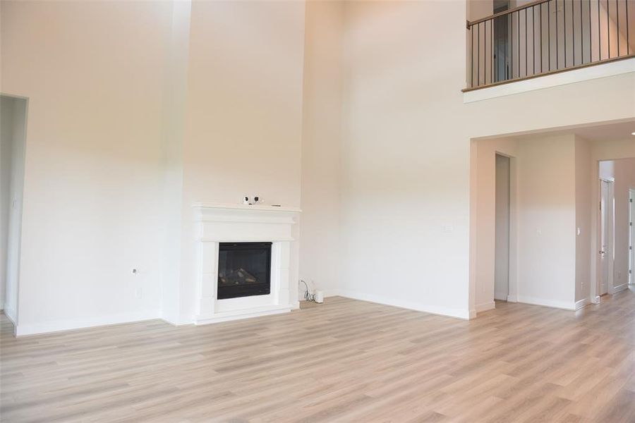 high ceiling in family room with gas fireplace