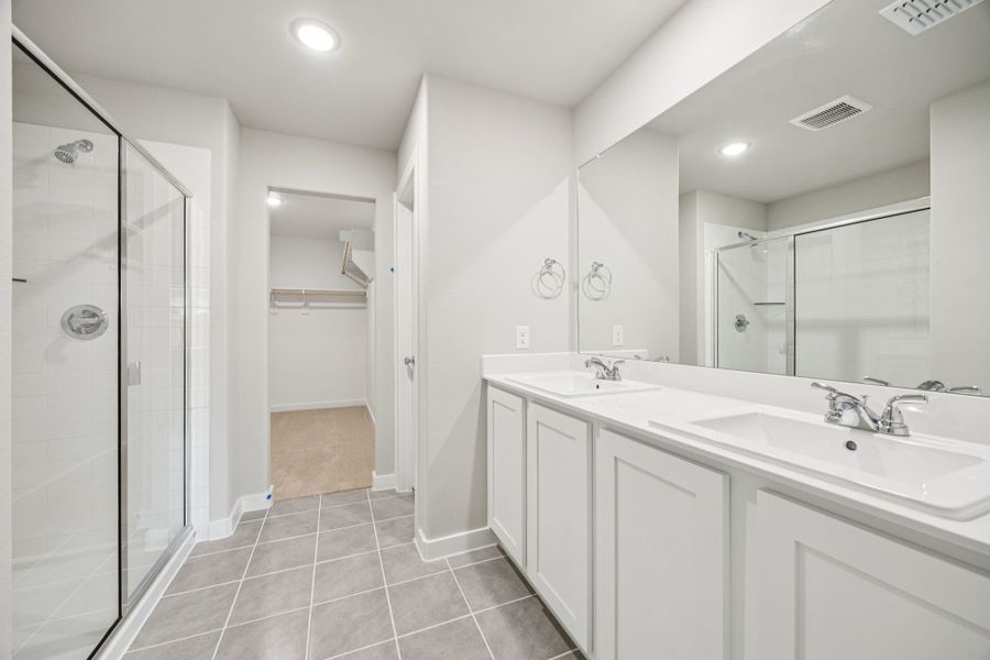 Primary Bathroom in the Hayden home plan by Trophy Signature Homes – REPRESENTATIVE PHOTO