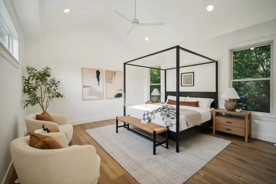 Bedroom featuring wood finished floors, ceiling fan, recessed lighting, and high vaulted ceiling