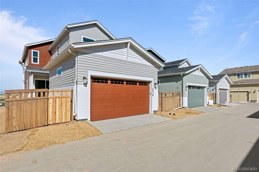 Front exterior of a new home in Painted Prairie, Aurora, CO, highlighting curb appeal (Image 26).