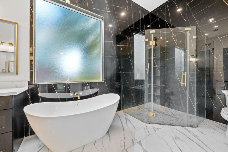 The floor to ceiling tile in a bathroom makes the space look luxurious, expansive and high-end.