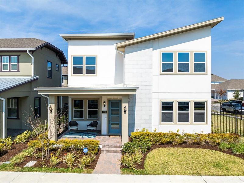 Front exterior of a new home in Laureate Park, Orlando, FL, highlighting curb appeal (Image 23).