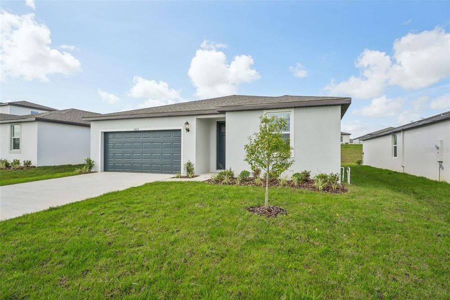 Front exterior of a new home in , Brooksville, FL, highlighting curb appeal (Image 12).