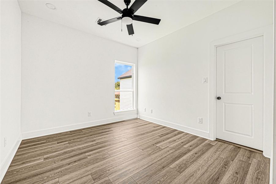 Comfortable bedroom with ample space and modern flooring. Comfortable bedroom with ample space and modern flooring.
