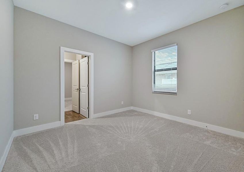 The spare bedroom has plenty of room and natural light