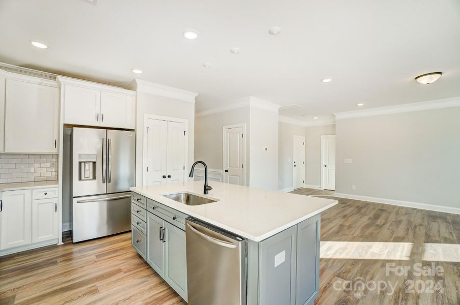 This home features all white cabinets and island