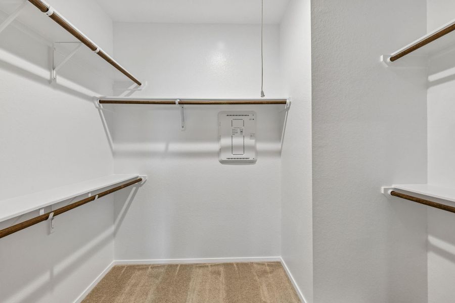 This new construction home features a beautifully designed primary walk-in closet that offers both generous space and everyday functionality.