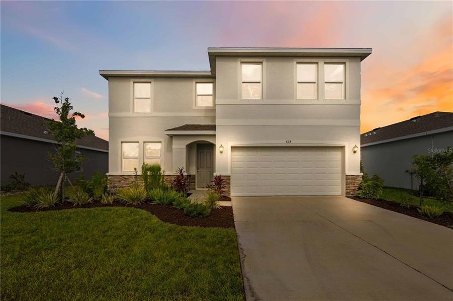 Front exterior of a new home in Coddington, Bradenton, FL, highlighting curb appeal (Image 24).