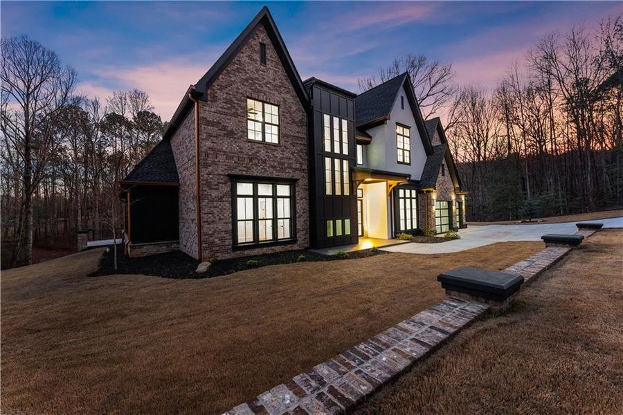 Front exterior of a new home in , Loganville, GA, highlighting curb appeal (Image 32). Front exterior of a new home in , Loganville, GA, highlighting curb appeal (Image 32).