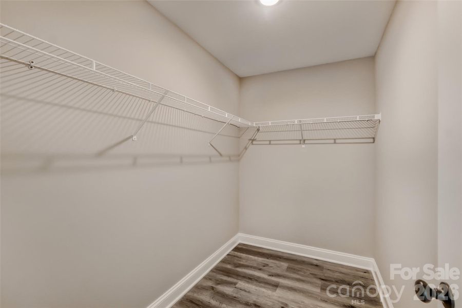 Primary suite walk-in closet Primary suite walk-in closet