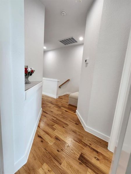 Hallway featuring light wood-type flooring