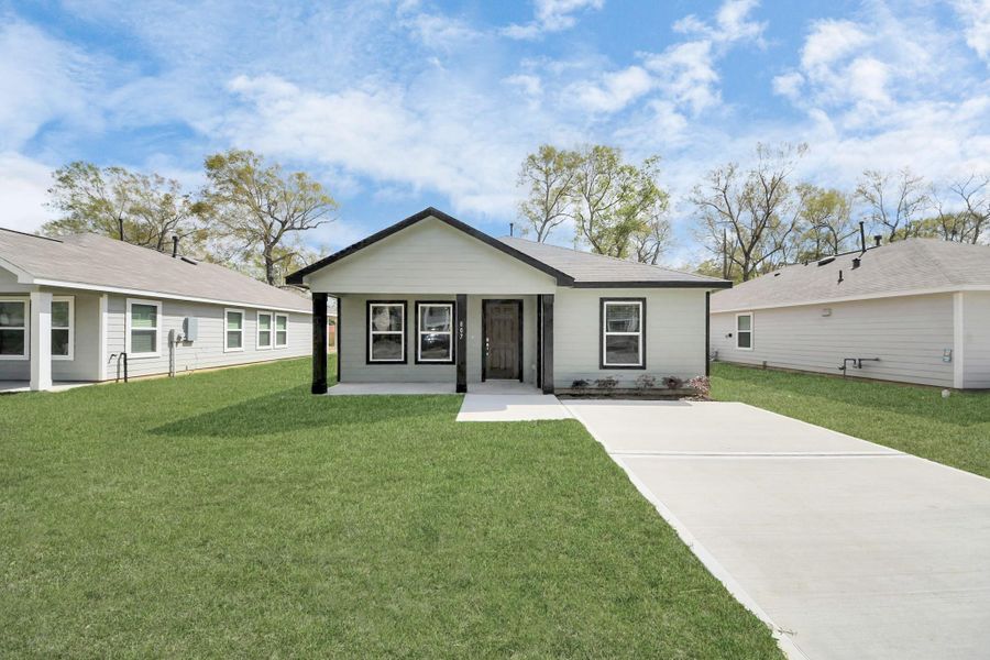 Front exterior of a new home in , Cleveland, TX, highlighting curb appeal (Image 3).