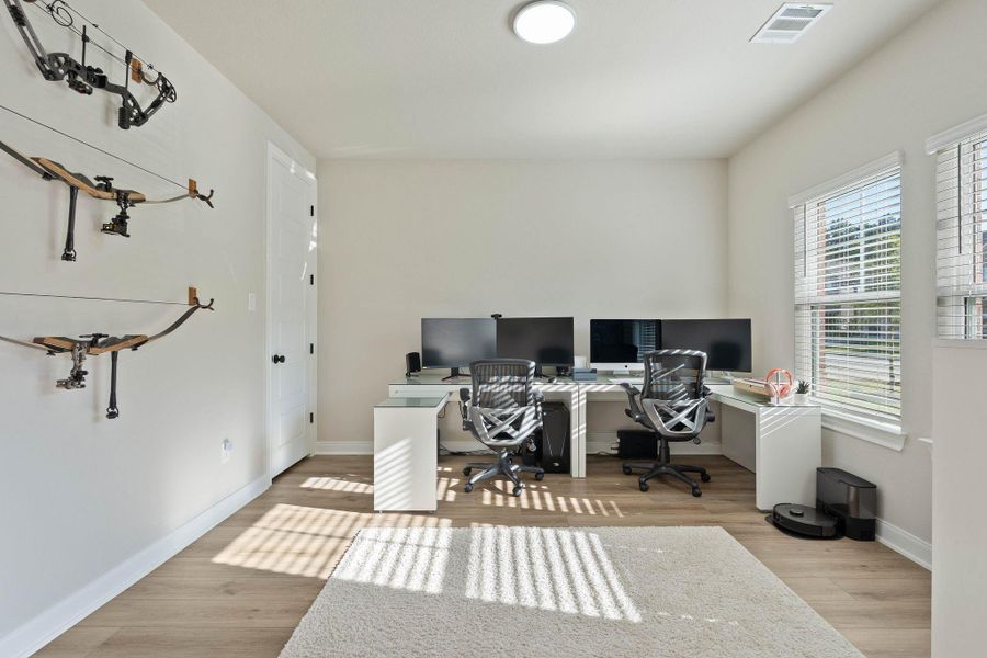 Bright, modern home office with large windows, light flooring ideal for remote work. This office features a closet offering the option for conversion to a 5th bedroom. Bright, modern home office with large windows, light flooring ideal for remote work. This office features a closet offering the option for conversion to a 5th bedroom.