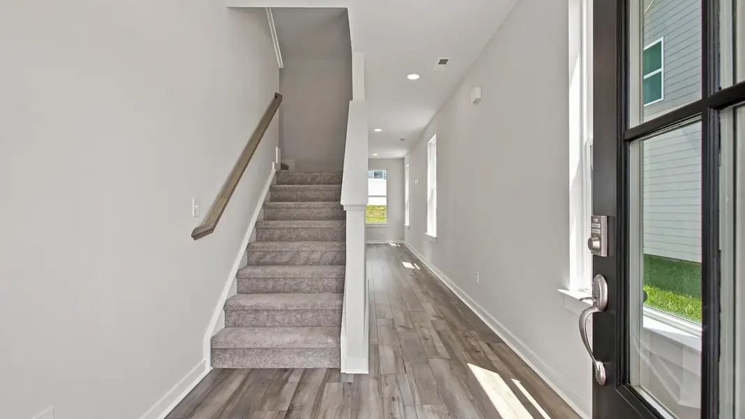 Immediate view of stairway and hallway from front door Immediate view of stairway and hallway from front door