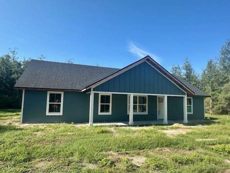 Front exterior of a new home in , Bell, FL, highlighting curb appeal (Image 10). Front exterior of a new home in , Bell, FL, highlighting curb appeal (Image 10).