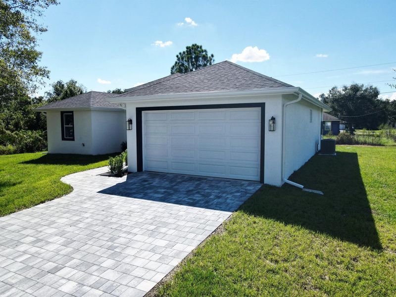 Front exterior of a new home in , Okeechobee, FL, highlighting curb appeal (Image 21).
