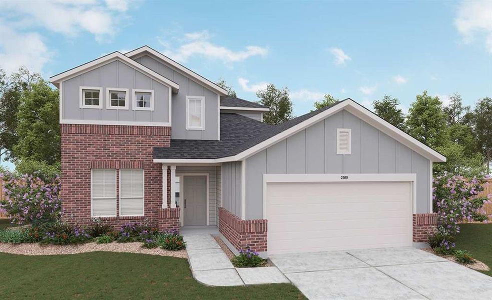 View of front of home featuring a garage and a front lawn