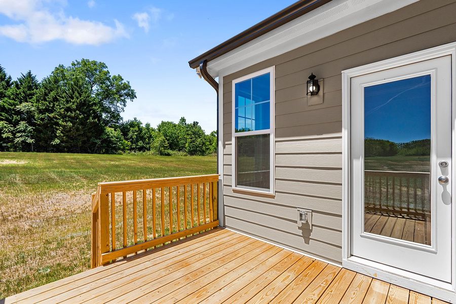 Exterior details and patio area of a home in Lilah Grove, Summerfield (Image 4).