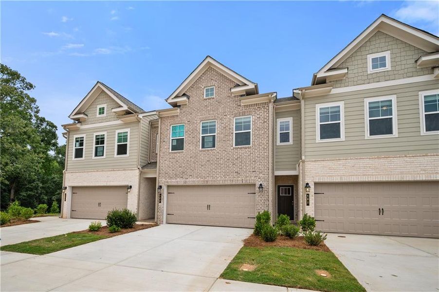 Front exterior of a new home in Abbotts Crossing, Conyers, GA, highlighting curb appeal (Image 24).