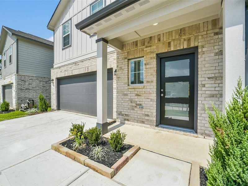 Exterior details and patio area of a home in Lakes at Black Oak, Magnolia (Image 21). Exterior details and patio area of a home in Lakes at Black Oak, Magnolia (Image 21).