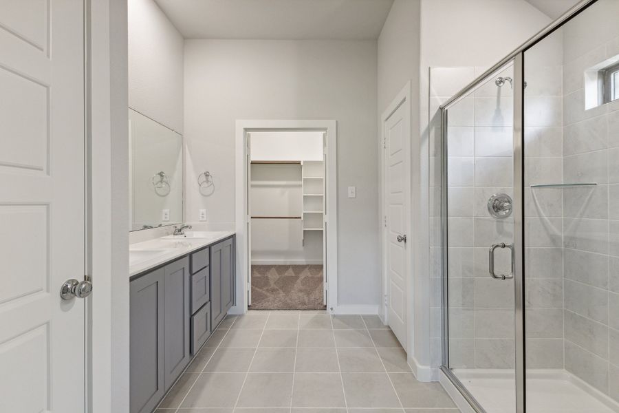 Primary Bathroom in the Quartz home plan by Trophy Signature Homes – REPRESENTATIVE PHOTO