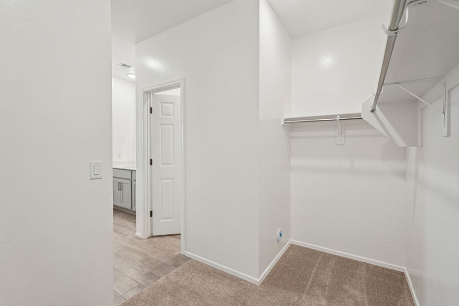 Primary walk in closet. Finishes and options may vary by community