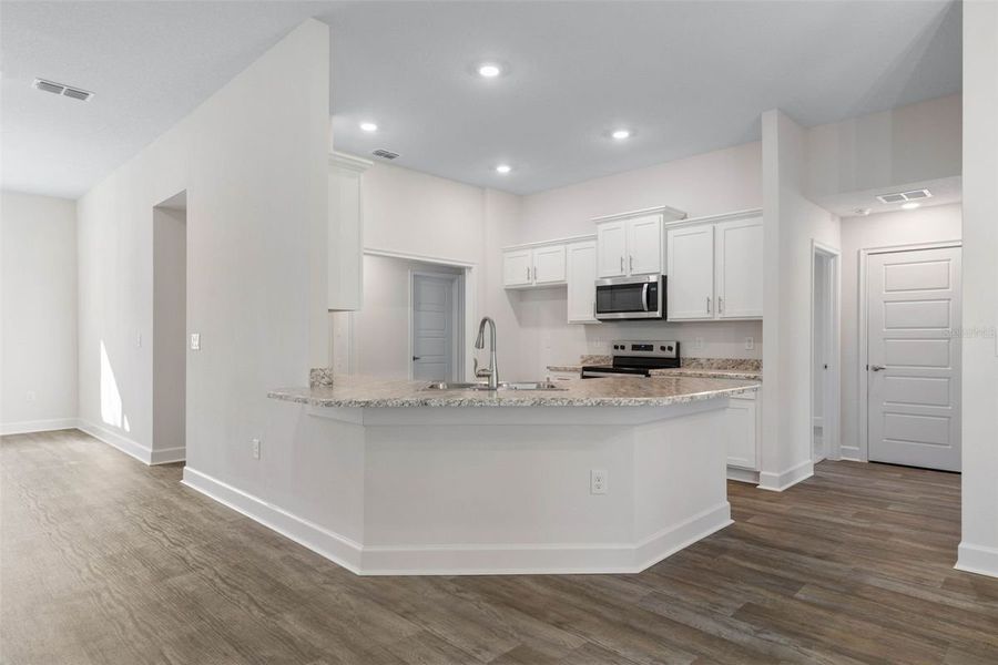 Representative furnished interior of a home built from the 2265 by Adams Homes in Veria, Oak Hill (Image 6).